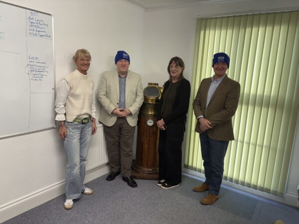 Merchant Navy Welfare Board and Veterans Outreach Support staff together after a Merchant Navy Welfare Board member induction
