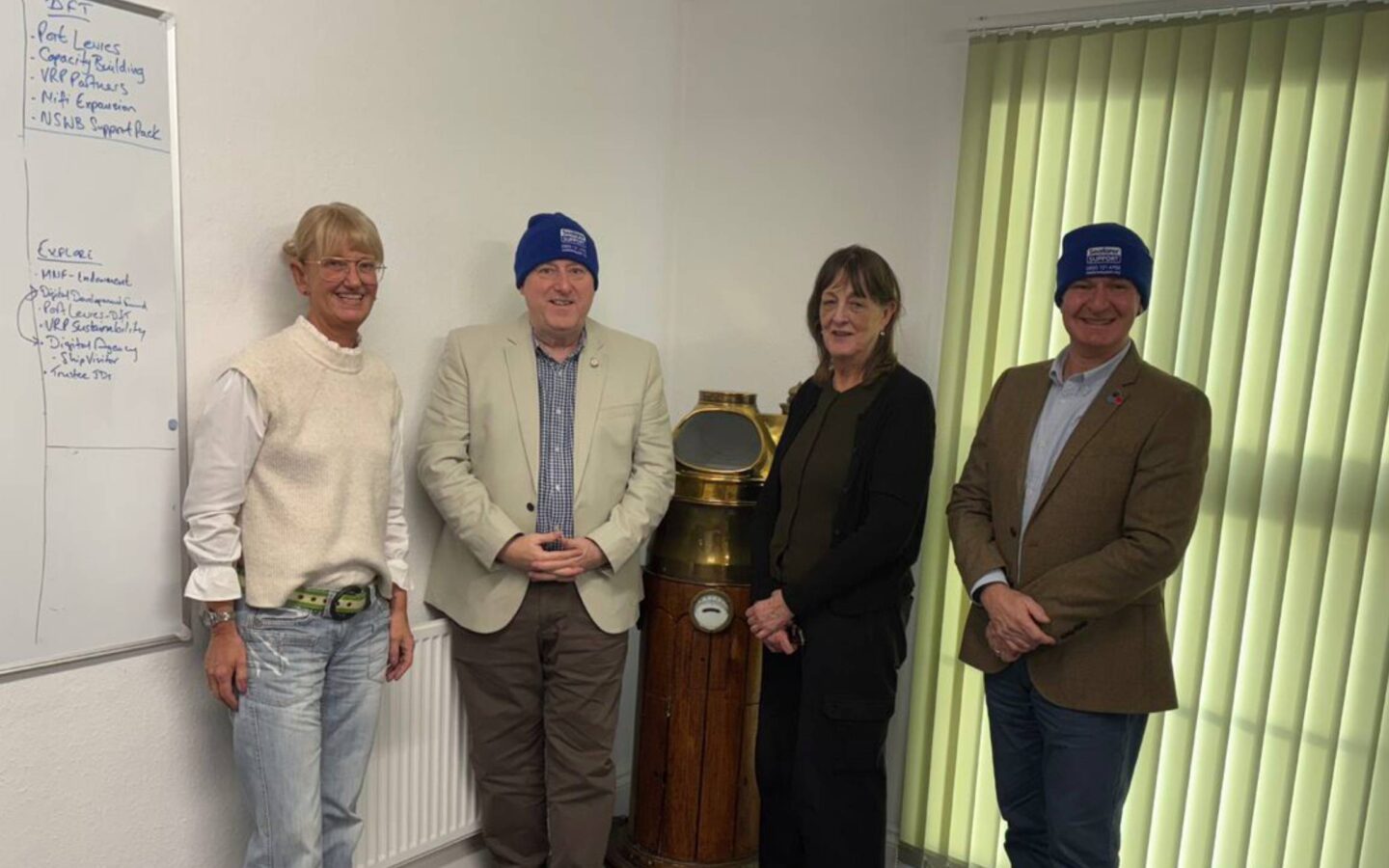 Merchant Navy Welfare Board and Veterans Outreach Support staff together after a Merchant Navy Welfare Board member induction