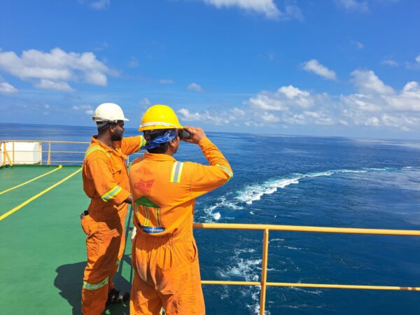 2 Seafarers looking at the sea